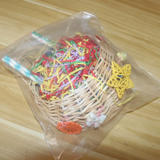 Woven basket bird toy filled with colorful shredded paper, paper tubes, and hanging chewable elements. - Image 15