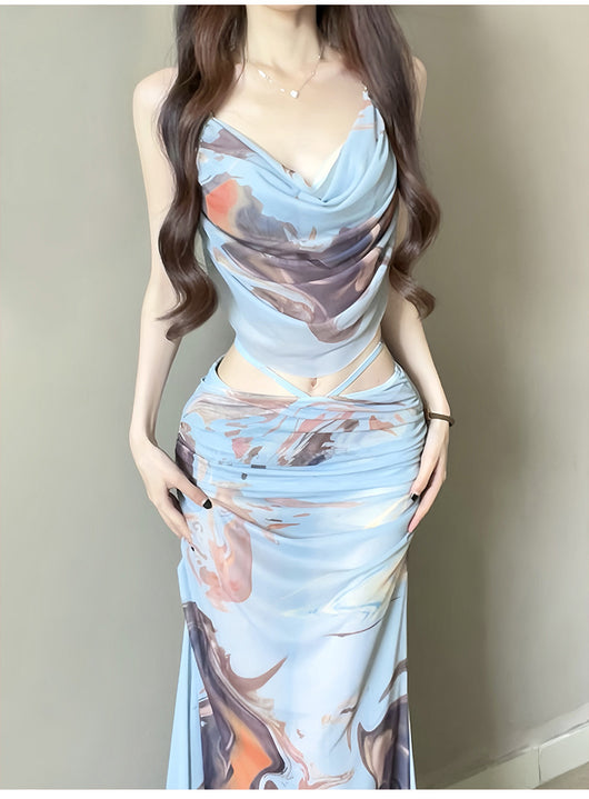 Purple and brown tie-dye two-piece swimsuit with a ruched cowl neck halter top and a matching high-waisted skirt. - Image 9