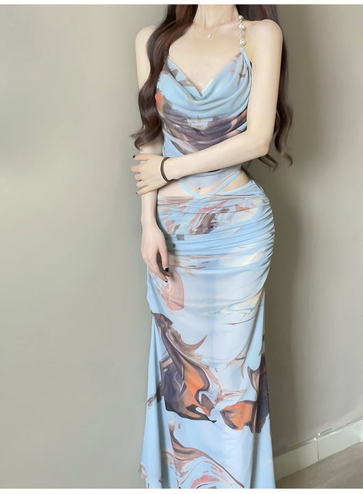 Purple and brown tie-dye two-piece swimsuit with a ruched cowl neck halter top and a matching high-waisted skirt. - Image 13