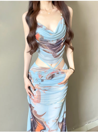 Purple and brown tie-dye two-piece swimsuit with a ruched cowl neck halter top and a matching high-waisted skirt. - Image 14