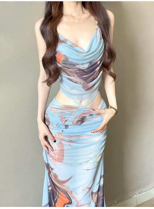 Purple and brown tie-dye two-piece swimsuit with a ruched cowl neck halter top and a matching high-waisted skirt. - Image 14