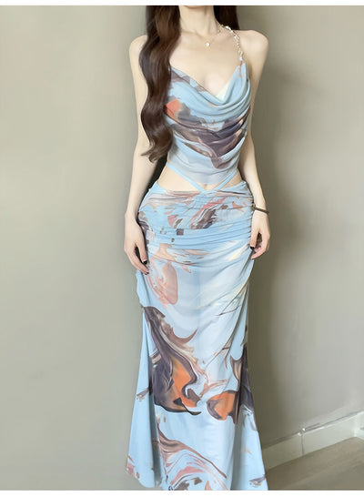 Purple and brown tie-dye two-piece swimsuit with a ruched cowl neck halter top and a matching high-waisted skirt. - Image 16
