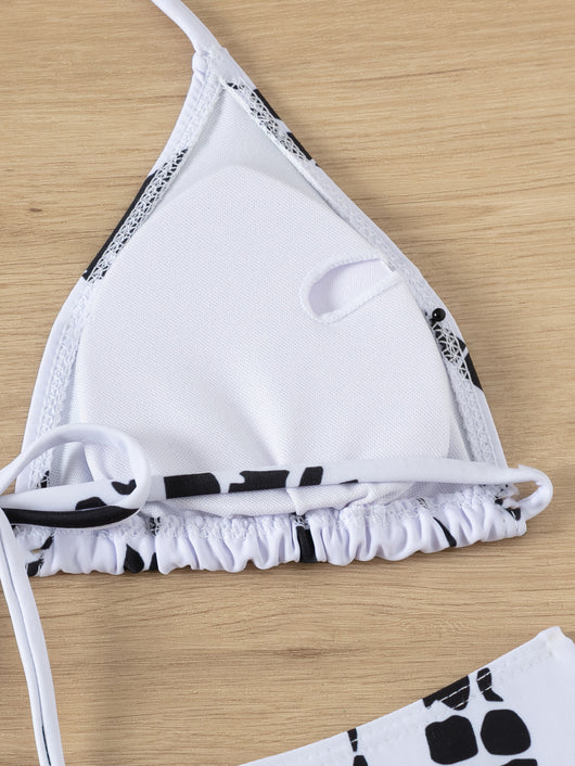 White and black tie-dye three-piece bikini set with a triangle top, high-cut bottoms, and a sheer long-sleeve cover-up. - Image 28