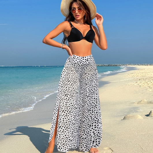 Women's pink, black, and white abstract striped bikini with a push-up top and strappy high-cut bottoms on a beach. - Image 34