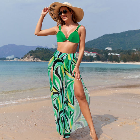 Women's pink, black, and white abstract striped bikini with a push-up top and strappy high-cut bottoms on a beach. - Image 41