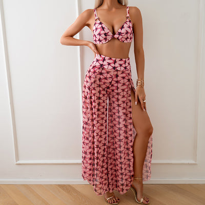 Women's pink, black, and white abstract striped bikini with a push-up top and strappy high-cut bottoms on a beach. - Image 43