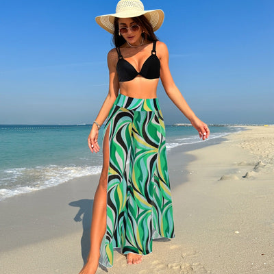Women's pink, black, and white abstract striped bikini with a push-up top and strappy high-cut bottoms on a beach. - Image 46