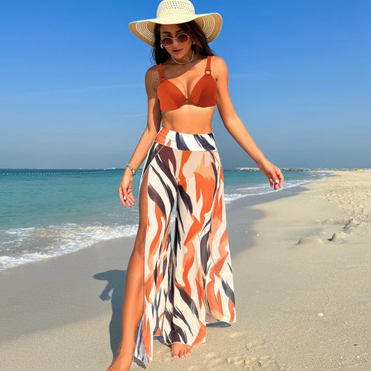 Women's pink, black, and white abstract striped bikini with a push-up top and strappy high-cut bottoms on a beach. - Image 51