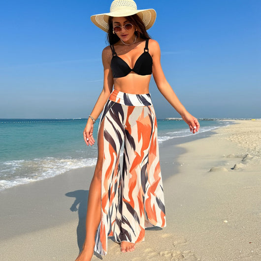 Women's pink, black, and white abstract striped bikini with a push-up top and strappy high-cut bottoms on a beach. - Image 54