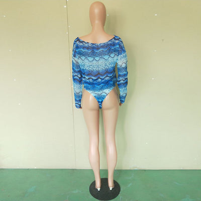 Woman in a purple and pink snakeskin print three-piece swimsuit with an off-shoulder crop top and high-waisted bottoms. - Image 30