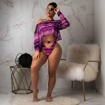 Woman in a purple and pink snakeskin print three-piece swimsuit with an off-shoulder crop top and high-waisted bottoms. - Image 36