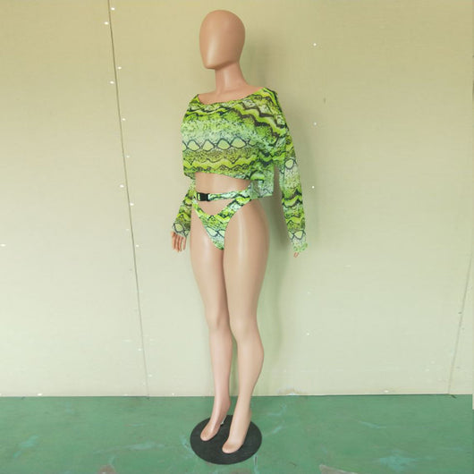 Woman in a purple and pink snakeskin print three-piece swimsuit with an off-shoulder crop top and high-waisted bottoms. - Image 38