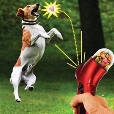 Red pet treat launcher with a clear reservoir filled with brown kibble, shown from side and top views with dimensions. - Image 9