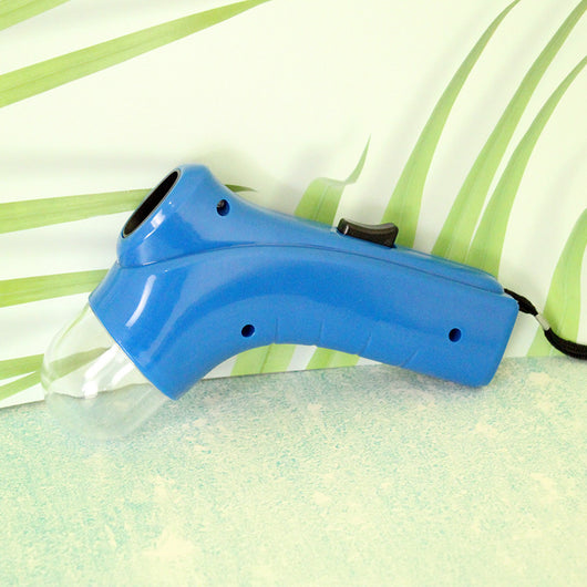 Red pet treat launcher with a clear reservoir filled with brown kibble, shown from side and top views with dimensions. - Image 14