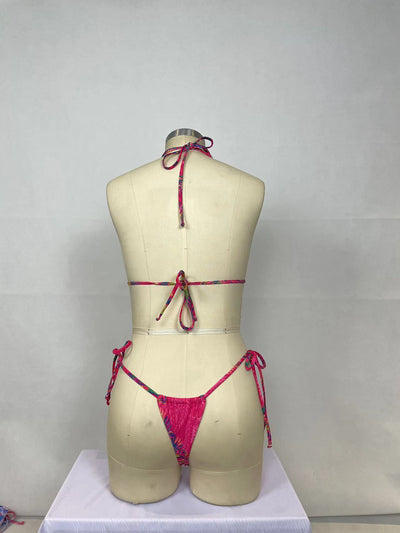 Women's pink paisley print bikini set with halter top featuring a cutout and tie-side thong bottoms. - Image 17
