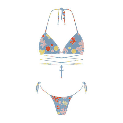 Woman in a light blue patterned triangle bikini with tie-side bottoms on a sandy beach with palm trees. - Image 38