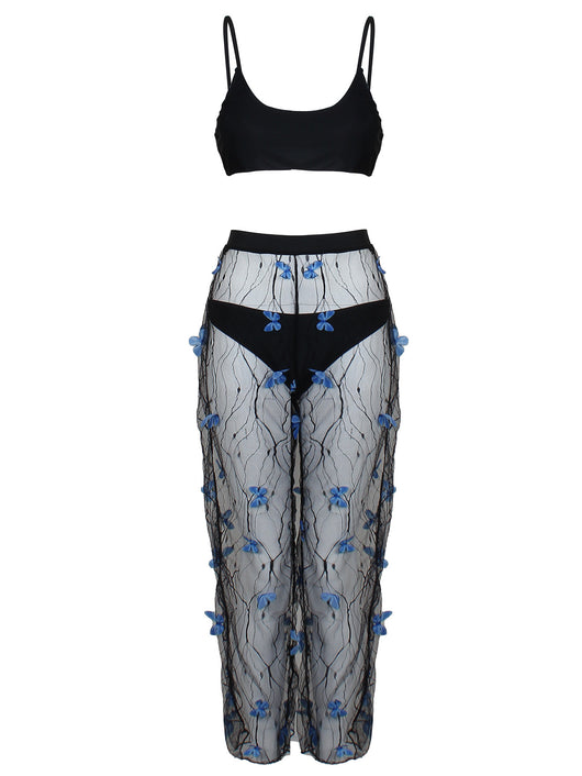 Women's black bikini three-piece set with a spaghetti strap top, matching bottoms, and sheer voile pants with blue butterfly appliques. - Image 15