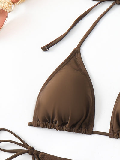Woman in a brown three-piece split swimsuit bikini set with a sheer mesh cover-up dress and a wide-brim straw hat. - Image 15