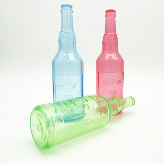 Translucent blue pet molar toy shaped like a bottle, featuring embossed paw prints and the word "DOG". - Image 26