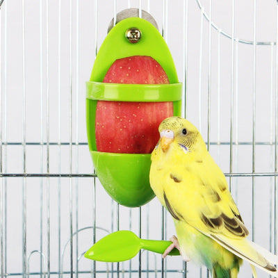 Bright green plastic bird food rack with a lower tray and a leaf-shaped perch, designed for cuttlefish. - Image 18