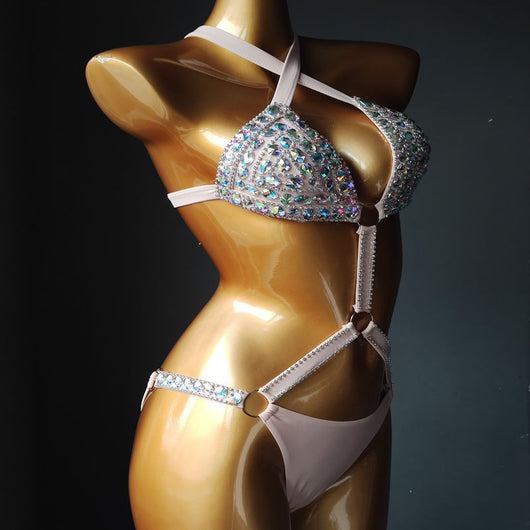 White rhinestone bikini with triangle tops, high-cut bottoms, and silver-toned O-rings and chains. - Image 8