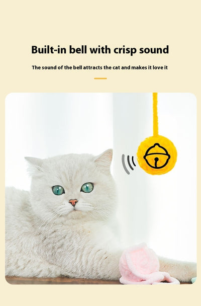 Colorful plush yarn ball cat toy in pink, blue, and white, with a long trailing strand, on a light background. - Image 52