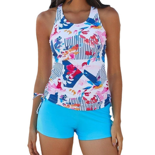 Women's geometric and floral print tankini top with blue swim shorts, featuring a racerback and ruched sides. - Image 13