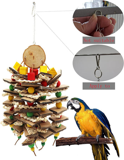 Parrot gnawing toy made of stacked cardboard, corn husks, and colorful wooden beads, with a parrot perched nearby. - Image 9