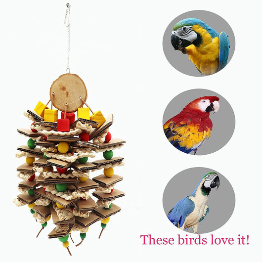 Parrot gnawing toy made of stacked cardboard, corn husks, and colorful wooden beads, with a parrot perched nearby. - Image 10