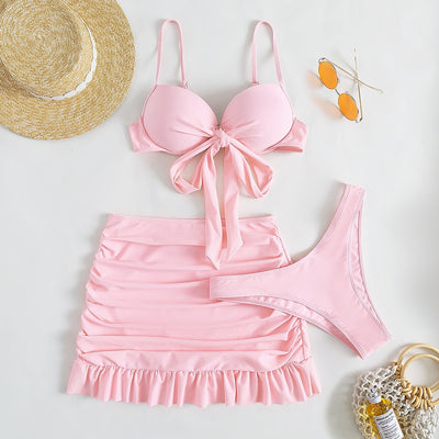 Light blue three-piece women's swimsuit with a bow-front bikini top, ruched mini skirt, and matching bottoms. - Image 10