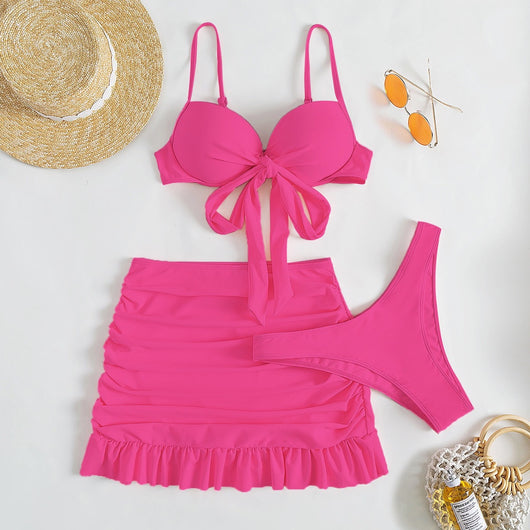Light blue three-piece women's swimsuit with a bow-front bikini top, ruched mini skirt, and matching bottoms. - Image 11