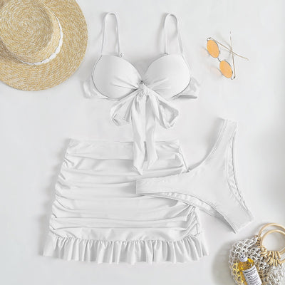 Light blue three-piece women's swimsuit with a bow-front bikini top, ruched mini skirt, and matching bottoms. - Image 14