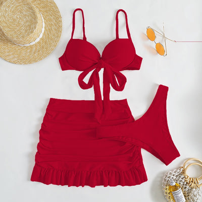 Light blue three-piece women's swimsuit with a bow-front bikini top, ruched mini skirt, and matching bottoms. - Image 15