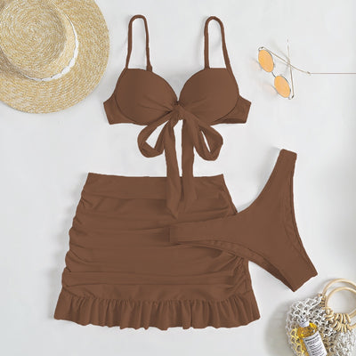 Light blue three-piece women's swimsuit with a bow-front bikini top, ruched mini skirt, and matching bottoms. - Image 16