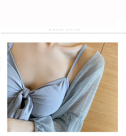 Women's light blue one-piece swimsuit with tie-front bust and ruffled hem, paired with a sheer shimmery cover-up. - Image 18