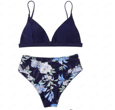 Navy blue bikini with a solid triangle top and high-waisted bottoms featuring a white and blue floral print. - Image 17