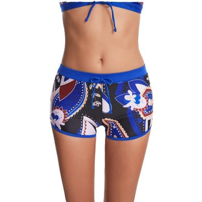 Women's flat-angle printed high-waist bikini with a halter top and shorts in blue, white, red, and black. - Image 11