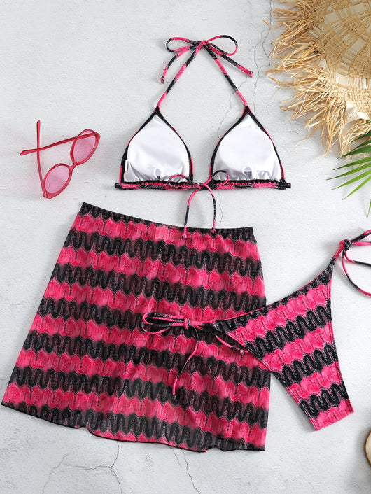 Three-piece printed swimsuit with a red and teal abstract pattern, featuring a halter bikini top, bottom, and mesh wrap skirt with drawstring. - Image 19