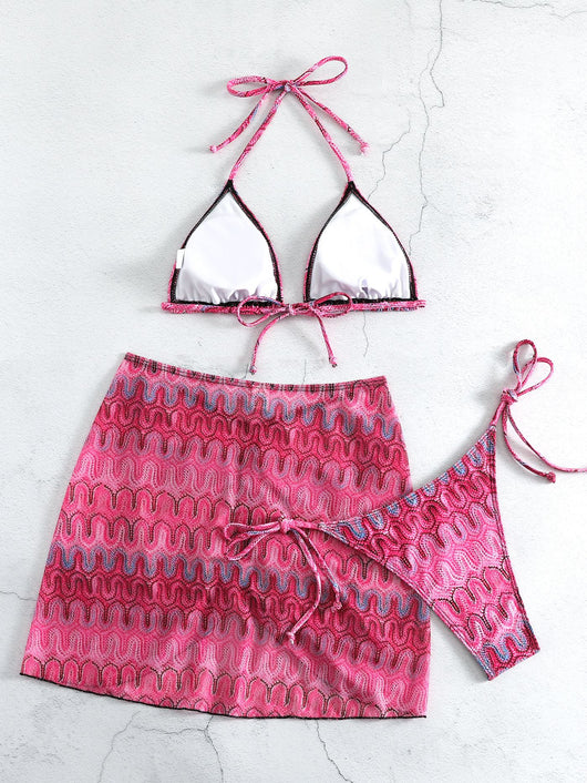 Three-piece printed swimsuit with a red and teal abstract pattern, featuring a halter bikini top, bottom, and mesh wrap skirt with drawstring. - Image 20
