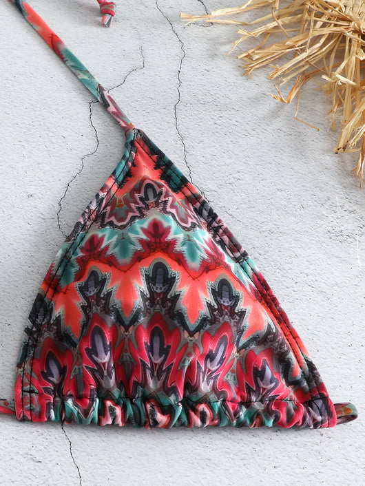 Three-piece printed swimsuit with a red and teal abstract pattern, featuring a halter bikini top, bottom, and mesh wrap skirt with drawstring. - Image 21