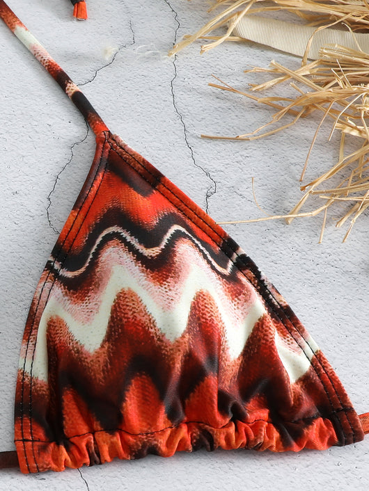 Three-piece printed swimsuit with a red and teal abstract pattern, featuring a halter bikini top, bottom, and mesh wrap skirt with drawstring. - Image 27