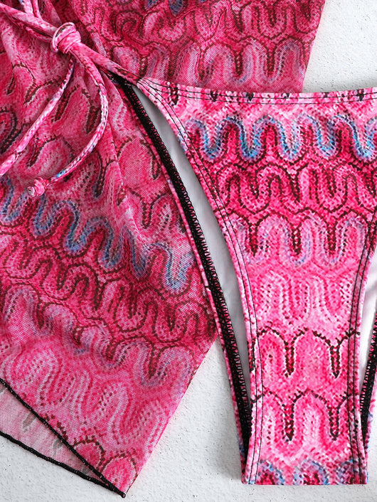 Three-piece printed swimsuit with a red and teal abstract pattern, featuring a halter bikini top, bottom, and mesh wrap skirt with drawstring. - Image 33