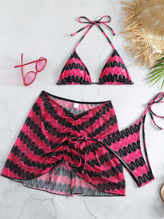 Three-piece printed swimsuit with a red and teal abstract pattern, featuring a halter bikini top, bottom, and mesh wrap skirt with drawstring. - Image 39