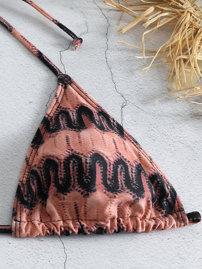 Three-piece printed swimsuit with a red and teal abstract pattern, featuring a halter bikini top, bottom, and mesh wrap skirt with drawstring. - Image 43