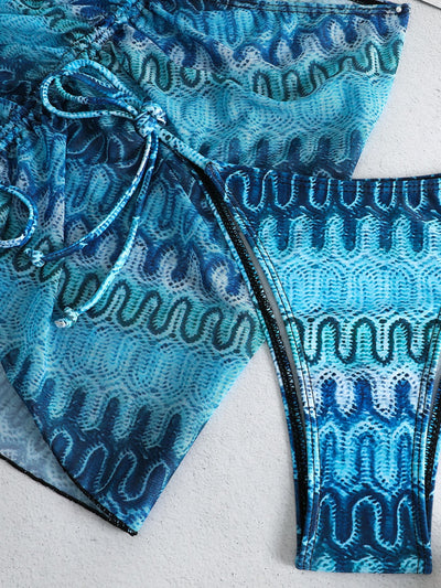 Three-piece printed swimsuit with a red and teal abstract pattern, featuring a halter bikini top, bottom, and mesh wrap skirt with drawstring. - Image 45