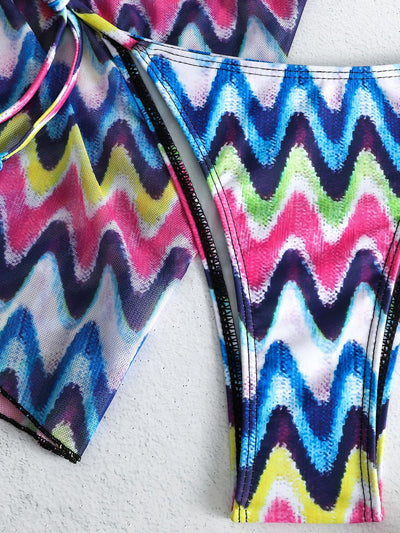 Three-piece printed swimsuit with a red and teal abstract pattern, featuring a halter bikini top, bottom, and mesh wrap skirt with drawstring. - Image 48