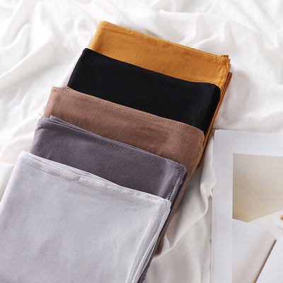 Black minimalist modal bottom hat integrated scarf, folded neatly on a white background. - Image 50