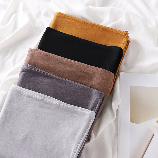 Black minimalist modal bottom hat integrated scarf, folded neatly on a white background. - Image 50