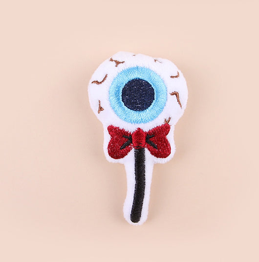 Plush cat teaser shaped like an eyeball lollipop with a blue iris, black pupil, and red bow. - Image 15