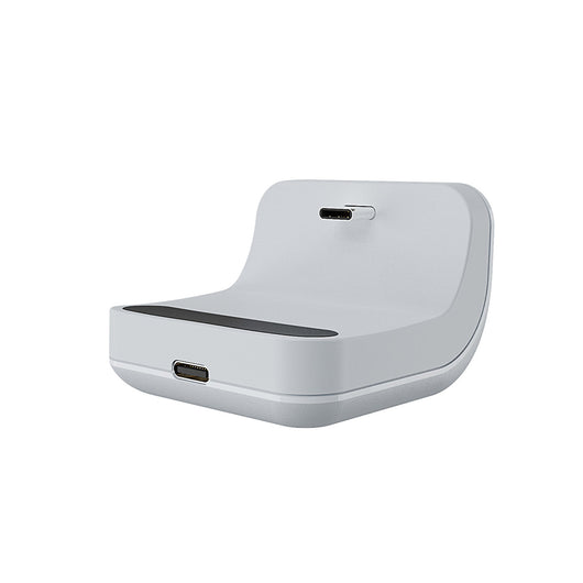White portable battery pack with digital display attached to a PS5 controller, showing 100% charge. - Image 20